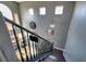 A grand staircase featuring dark wood steps and banister, providing an elegant focal point at 7609 Rory Ct, Las Vegas, NV 89129