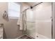 Bathroom with glass shower doors, subway tile, and a linen closet at 7721 Sheliak St, North Las Vegas, NV 89084