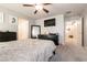 Carpeted bedroom featuring ceiling fan, dresser, and open doorway at 7721 Sheliak St, North Las Vegas, NV 89084