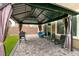 Shaded patio featuring pavers, an outdoor kitchen, and comfortable lounge furniture at 7721 Sheliak St, North Las Vegas, NV 89084