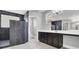 This spacious bathroom features a modern vanity with dark cabinets, a large mirror, and a luxurious walk-in shower at 7878 Brianna Cheerful Ave, Las Vegas, NV 89178
