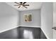 Bright bedroom with hardwood floors, a ceiling fan, and natural light, perfect for relaxation at 7878 Brianna Cheerful Ave, Las Vegas, NV 89178