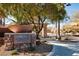 Inviting entrance to Cascade at Mountain's Edge with stone signage and lush landscaping at 7878 Brianna Cheerful Ave, Las Vegas, NV 89178