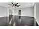 Expansive living room with hardwood floors, and modern details, perfect for relaxation and social gatherings at 7878 Brianna Cheerful Ave, Las Vegas, NV 89178