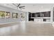 Expansive living room with lots of natural light, seamlessly connected to the modern kitchen at 7878 Brianna Cheerful Ave, Las Vegas, NV 89178