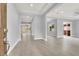 Bright, open-concept living room with tile floors, recessed lighting, and access to the backyard at 7878 Brianna Cheerful Ave, Las Vegas, NV 89178