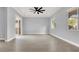 Large living room features tile flooring, recessed lighting, ceiling fan, and sliding door to outdoor space at 7878 Brianna Cheerful Ave, Las Vegas, NV 89178