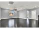 Loft with dark floors, recessed lighting, ceiling fan and light-filled windows create an inviting upper-level space at 7878 Brianna Cheerful Ave, Las Vegas, NV 89178