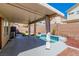 Backyard featuring a small pool, patio, and privacy wall at 7990 Timber Horn Ct, Las Vegas, NV 89147
