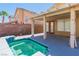 Backyard with a small pool, patio, and privacy wall at 7990 Timber Horn Ct, Las Vegas, NV 89147