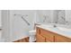 Bathroom featuring a vanity with wood cabinets and a sink, with wood floor and handrails at 7990 Timber Horn Ct, Las Vegas, NV 89147