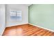 Bedroom with wood floors, neutral paint, and shuttered windows at 7990 Timber Horn Ct, Las Vegas, NV 89147