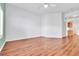 Spacious room with wood floors, a ceiling fan, and light-colored walls at 7990 Timber Horn Ct, Las Vegas, NV 89147