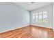 Bright bedroom with wood floors and large windows offering ample natural light at 7990 Timber Horn Ct, Las Vegas, NV 89147