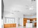 Open layout featuring a kitchen with modern appliances and cabinetry, seamlessly connected to the living area at 7990 Timber Horn Ct, Las Vegas, NV 89147