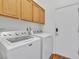 Laundry room with side-by-side washer and dryer, and built-in cabinets above at 7990 Timber Horn Ct, Las Vegas, NV 89147