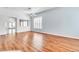 Bright living room with wood floors, fresh paint, shutters, and arched doorways for a welcoming ambiance at 7990 Timber Horn Ct, Las Vegas, NV 89147