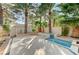 Beautiful backyard featuring lush landscaping and peaceful water fountain features at 8051 Castle Pines Ave, Las Vegas, NV 89113