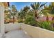 Balcony view showcasing palm trees and neighborhood homes at 8051 Castle Pines Ave, Las Vegas, NV 89113