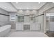 Luxurious bathroom with dual vanities, marble accents, and a soaking tub at 8051 Castle Pines Ave, Las Vegas, NV 89113
