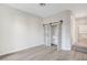 Bedroom featuring wood floors and barn door closet with built-ins at 8051 Castle Pines Ave, Las Vegas, NV 89113