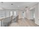 Bright hallway featuring staircase, modern floors, and decorative glass windows at 8051 Castle Pines Ave, Las Vegas, NV 89113