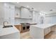 The renovated kitchen has stainless steel appliances and white countertops at 8051 Castle Pines Ave, Las Vegas, NV 89113