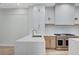 Modern kitchen with stainless steel appliances and a large island at 8051 Castle Pines Ave, Las Vegas, NV 89113