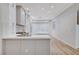 Well-lit kitchen featuring an island and stainless steel appliances at 8051 Castle Pines Ave, Las Vegas, NV 89113