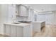 Open concept kitchen featuring an island and stainless steel appliances at 8051 Castle Pines Ave, Las Vegas, NV 89113