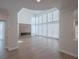 Grand living room with high ceilings, fireplace, and expansive windows offering abundant natural light at 8051 Castle Pines Ave, Las Vegas, NV 89113