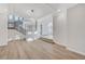 Bright living room featuring hardwood floors, a staircase, and lots of light at 8051 Castle Pines Ave, Las Vegas, NV 89113
