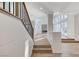 Inviting living room features a staircase, large windows, and modern finishes at 8051 Castle Pines Ave, Las Vegas, NV 89113