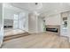 Spacious living room featuring hardwood floors and a fireplace at 8051 Castle Pines Ave, Las Vegas, NV 89113