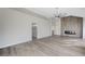 Spacious living room featuring wood floors, fireplace and vaulted ceilings at 8051 Castle Pines Ave, Las Vegas, NV 89113