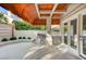 Outdoor kitchen with stainless steel grill and sink, under a canopy at 8051 Castle Pines Ave, Las Vegas, NV 89113