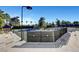 Outdoor tennis courts with spectator seating surrounded by mature trees, providing a comfortable viewing experience at 8051 Castle Pines Ave, Las Vegas, NV 89113