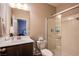 Bathroom with a glass-enclosed shower, single sink vanity, and modern fixtures at 8171 California Pine St, Las Vegas, NV 89166