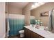 Bathroom features a double sink vanity with modern fixtures and neutral earth tone walls at 8171 California Pine St, Las Vegas, NV 89166