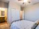 Cozy bedroom with a ceiling fan, closet, and bathroom entrance at 8171 California Pine St, Las Vegas, NV 89166