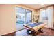 A dining room showcases an access door to an outdoor living space and hardwood floors at 8171 California Pine St, Las Vegas, NV 89166
