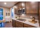 Modern kitchen features stainless steel appliances, white countertops, and subway tile backsplash at 8171 California Pine St, Las Vegas, NV 89166