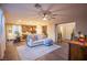 Spacious living area seamlessly flows into kitchen, featuring recessed lighting, and wood flooring at 8171 California Pine St, Las Vegas, NV 89166
