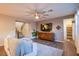 Open-concept living room featuring hardwood floors, a ceiling fan, and neutral wall paint at 8171 California Pine St, Las Vegas, NV 89166