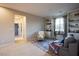 Spacious and bright living room with built-in shelves, comfortable seating, and carpet flooring at 8171 California Pine St, Las Vegas, NV 89166
