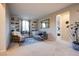 Neutral living room with built-in bookshelves, comfortable seating, and ample natural light at 8171 California Pine St, Las Vegas, NV 89166