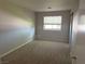 Bedroom with carpet, small window with blinds and closet with mirror sliding door at 881 E Calvada Blvd, Pahrump, NV 89048