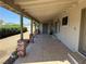 Long covered patio, great for relaxation with patterned tiled floor and brick columns at 881 E Calvada Blvd, Pahrump, NV 89048