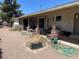 Covered patio area with brick accents and sliding glass doors at 881 E Calvada Blvd, Pahrump, NV 89048