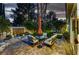 Inviting backyard patio featuring privacy landscaping and serene water feature at 8969 Rivers Edge Dr, Las Vegas, NV 89117